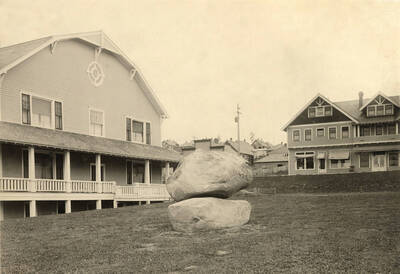 View of gymnasium the two large granite boulders are a memorial to William Deary. The building on the right is the hotel.
