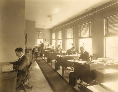 Employees at their desks.