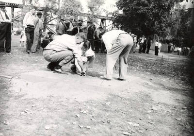 Horseshoe contest judges.