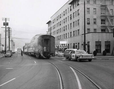 A train, led by a police car makes its way to the Jaype Mill dedication from Lewiston.