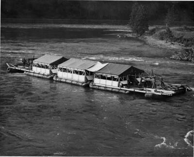 A wanigan floats down the Clearwater River.