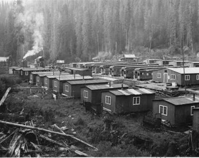 Camp 14 in the St. Joe National Forest, Idaho. In this camp are both more permanent type structures (foreground) and converted railroad cars (background).