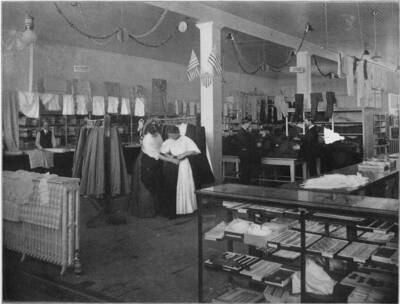 The dry goods and clothing department in the Potlatch Mercantile Company store. Scanned from the book 'Potlatch Lumber Company: Manufacturers of Fine Lumber'. The back cover says 'Photographed and published by F. D. Straffin, 336 Riverside Ave. Spokane Wash. Printed by Inland Printing Co. Spokane, Wash'.