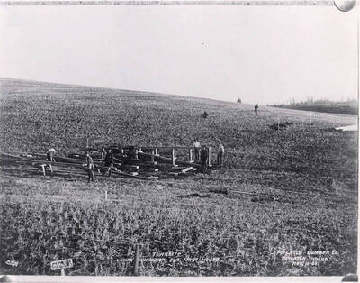 Men are laying the foundation for the first house in Potlatch.