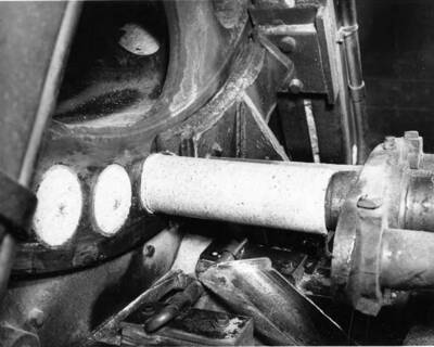 A machine feeds logs into a Pres-to-Log machine at the plant in Lewiston, Idaho.