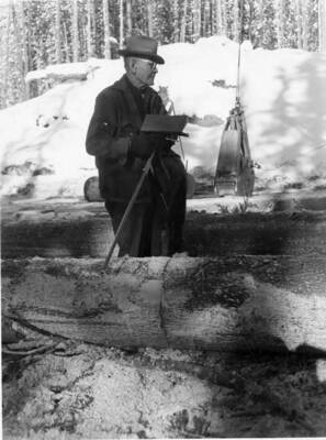The state scaler stands watching and making notes at Clear Creek landing.