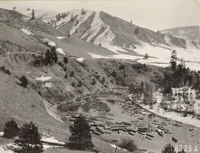 Logs are scene jammed at in low water. The description on envelope says 'Jam. Logs being up at low at below rollway. Payette N.F.'