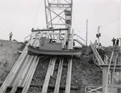A tugboat is lowered on slides.