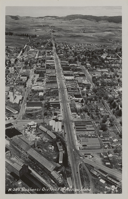 Postcard is an aerial photograph of the business district of Moscow, Idaho.