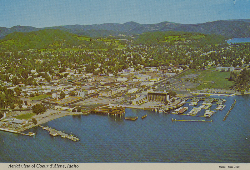 Postcard is an aerial photograph of Coeur d'Alene, Idaho.