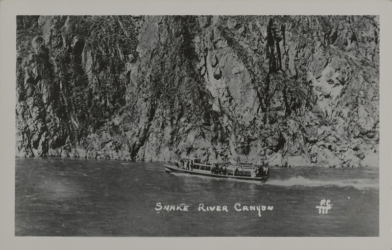 Postcard of a boat in the Snake River Canyon.