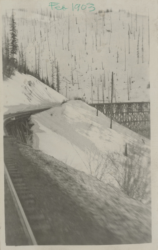 Snow slide at railroad trestle.