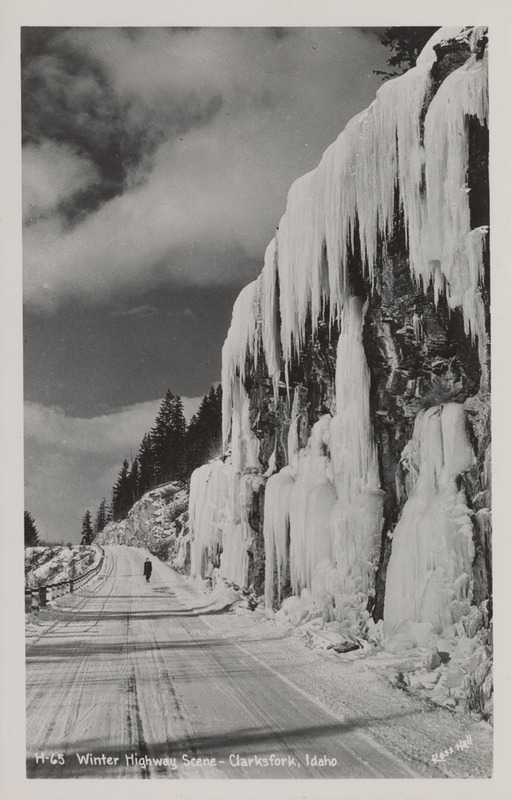 Postcard of a highway covered in snow and ice near Clark Fork, Idaho.