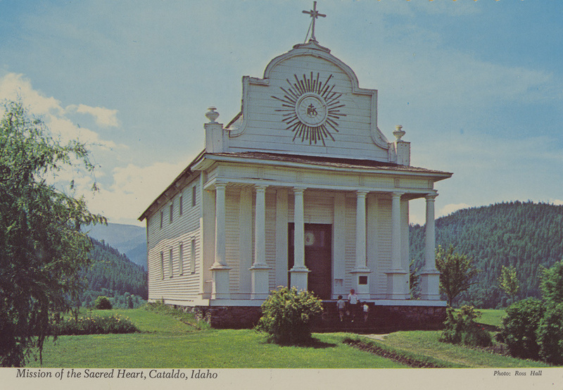 Postcard of the Cataldo Mission church in Cataldo, Idaho. | Mission at Cataldo, Idaho, construction began in 1848 by Father Anthony Ravalli S.J. With broad axe, auger and pocket knife for tools, and a band of untutored Indians for help, the old mission has stood to become Gem State's oldest building. The mission was designated a "National Historic Landmark" by Congress in 1962.