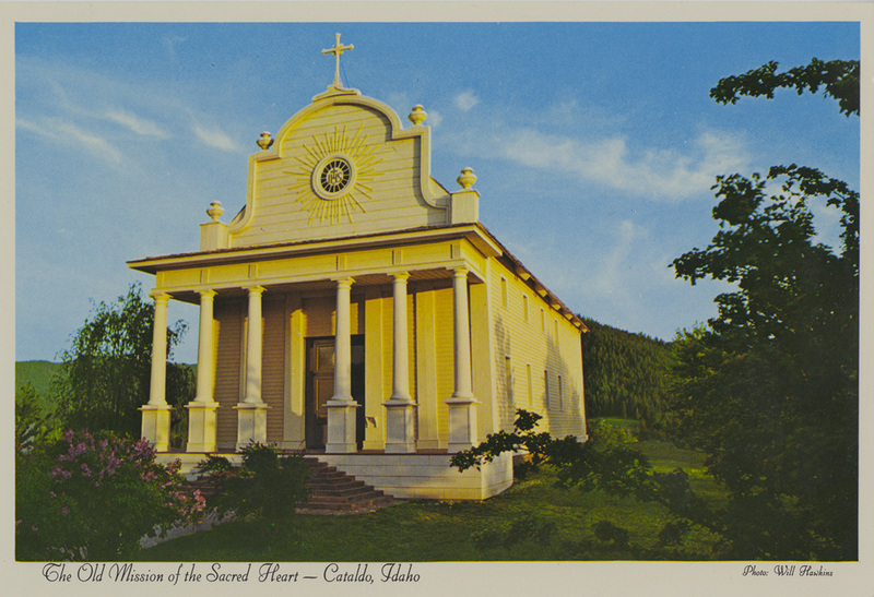 Postcard of the Old Mission of the Sacred Heart in Cataldo, Idaho. | This historic mission is the oldest remaining building in Idaho, and is now a State Park. It was built in 1848-53 by members of the Coeur d'Alene Indian Tribe under the supervision of Father Ravalli. The Mission stands serenely on its own hill 20 miles east of Coeur d'Alene, along Interstate 90 in Northern Idaho Panhandle. It was completely restored in the mid 1970's.
