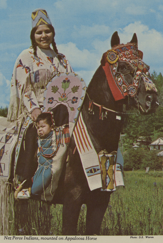 Postcard of a woman and child on horseback. | Full blood Nez Perce Indians mounted on an Appaloosa horse, with authentic trappings of late era.