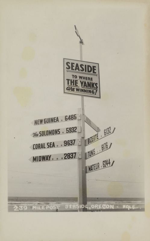 Postcard of a sign marking the distance to several different places in Seaside, Oregon.