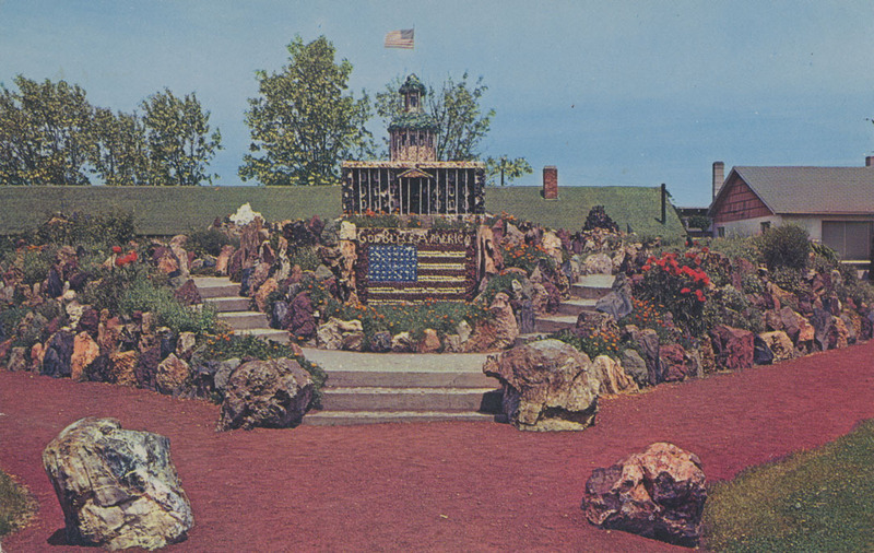 Postcard of the Petersen Rock Garden near Redmond, Oregon. | Petersen Rock Gardens and Museum is located between Ben and Redmond, Oregon. A patriotic theme is to be found in it's construction. The varied colors of the rocks make its beauty outstanding. Many geological stories are also told in the selection of rocks used in this garden.