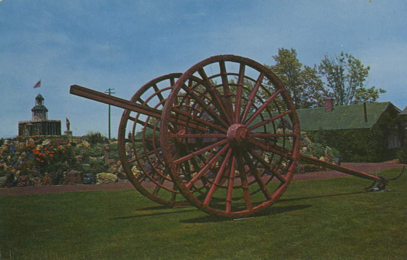 Postcard of a wagon wheel at the Petersen Rock Garden near Redmond, Oregon.| Petersen Rock Gardens, Redmond, Oregon. Old logging wheel used to haul logs in Oregon before the advent of the log truck.