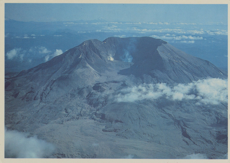 Postcard of Mount St. Helens sometime after the 1980 eruption. | Mt. St. Helens, following violent eruption activities, still shows some volcanic activity. The mountain lost approx. 1300 ft. of its summit on May 18, 1980 eruption. 156 square miles of surrounding wilderness-like setting was wrecked, and buried in up to 100 feet of ash and debris. This view looks south into the devastated mountain.