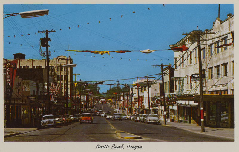 Postcard of North Bend, Oregon along Highway 101. | One of the busy coastal lumbering cities of Oregon.