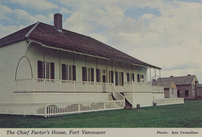 Postcard of a house in Fort Vancouver in Vancouver, Washington. | "The Big House" as it was known in 1838 was the residence of Dr. John McLoughlin and family. The home was rebuilt in detail from photos, written descriptions and archaeological evidence, resting on its original location within the Fort. There are nine rooms on the first floor, including a large dining hall. Two rooms are upstairs. The kitchen is a separate building at the rear connected by a short hallway. The bakery and a storage building are seen on the right.