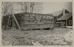 Postcard of the old Idaho City jail in Idaho City, Idaho. |  What is left of the old Idaho City jail built in the old territorial days. Note the hewed logs and dovetailed corners. Community Hall, Idaho City.