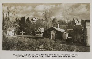 Postcard of Idaho City, Idaho looking east. On front: The south end of Idaho City looking east, in the background shows the I.O.O.F. Hall and the Catholic Church, both built in 1865.