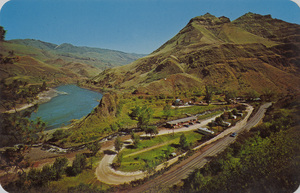 Postcard of a hotel in White Bird, Idaho. | Chief White bird Motel & Trailer Park. Location: On U.S. #95, White Bird, Idaho. Mouth of White Bird Creek & Salmon River. 1 1/2 miles south of White Bird. Excellent fishing, hunting. 25 camper-trailer spaces. Trophy room, color TV. Air cond. - with or without kitchen. Coin laundry & dry cleaners. Large grassy playground. Phone, White Bird, Idaho 839-4421.