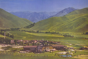 Postcard of the Sun Valley Resort in Sun Valley, Idaho with the main lodge building in the foreground. | With facilities and accommodations second to none, the famous Idaho resort, in its delightful mountain setting, ranks as one of the West's outstanding spots. Sun Valley itself, and the immense and beautiful area in which it is located add up to a byword in summer vacation topics.