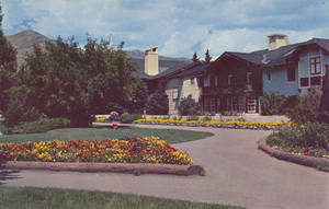 Postcard of flowers around an Inn in Sun Valley, Idaho.  | Flower border around east wing, Challenger Inn Sun Valley, Idaho.
