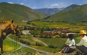 Postcard of the Sun Valley Resort from nearby Penny Mountain with horses and riders in the foreground. | Sun Valley from nearby Penny Mtn.