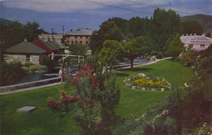 Postcard of the gardens at Lava Hot Springs in Lava Hot Springs, Idaho. | One of the many State Foundation flower gardens where visitors rest, relax and enjoy the fragrant colorful flowers, shrubs, velvet green lawns and shade, and listen to the chatter of the tumbling waters of the famous fishing stream, the Portneuf River, rushing by or the U.P. Streamliner whizzing along and the Bear Lake Stages unloading its many passengers. A real convalescing and restful paradise located on Hi-way 30N and the main line of the U.P.P.R. Write Lava Hot Springs Foundation for further information.