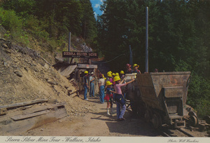 Postcard of a tour at the Sierra Silver Mine near Wallace, Idaho. | The mine-ore car and the portal (entrance) are the visitor's introduction to a hard-rock mine tour in the Silver Valley. The tour is a truly unique experience to observe actual demonstrations of mining equipment and techniques, which are used to produce one-half of the nation's silver from mines in this area.