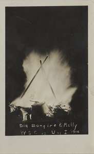 Postcard of a bonfire during a rally for a football game in 1918.