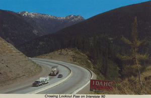 Postcard of Lookout Pass on Interstate 90 near the Idaho-Montana border. | The first site of Idaho from Montana, on Interstate 90, is spectacular. The aptly named Lookout Pass gives breathtaking views of the valley around Mullan, Idaho, if you dare take your attention from the incessant curves in the roadway.