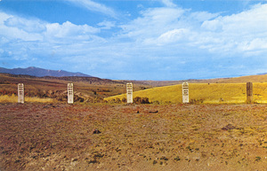 Postcard of graves overlooking the city in Virginia City, Montana. | Road Agent's Graves, Historic Virginia City, Montana. Here atop Boot Hill, overlooking the city they once plundered lie five members of the notorious Plummer gang.