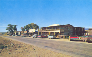 Postcard of historic buildings and cars in Nevada City, Montana.