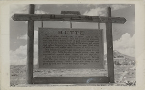 Postcard of a historic marker near Butte, Montana.