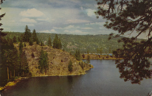 Postcard is of Payette Lake in Idaho | Payette Lake on North Fork of the Payette River, Idaho, is reached over Highway 15 from Boise or Highway 95. Wooded shore lines, crystal-clear water are characteristic of Idaho's vacation land jeweled with excellent fishing lakes and streams. Union Oil Company's Natural Color Scenes of the West. Tour the West this year with 76 gasoline.