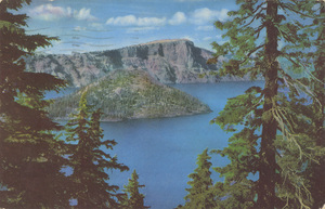 Postcard is a photograph of Wizard Island in Crater Lake National Park, Oregon.  | Crater Lake, Oregon, reposing in the crater of a once gigantic volcano, is indigo blue and encircled by multi-colored lava walls 500 to 2000 feet high. Several state highways go into he lake off U.S. Highway 97 and off 99 from Medford.