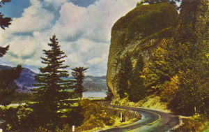 Postcard is a photograph of a rock formation along the Historic Columbia River Highway.  | Shepperd's Dell. One of the many beautiful spots along the Columbia River Highway. At the roadside a waterfall drops into a shadowy grotto.