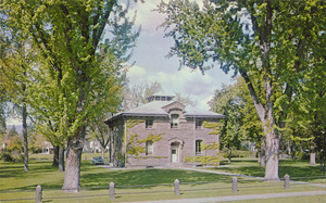 Postcard is a photograph of the Old U.S. Assay Office in Boise, Idaho. | The Old U.S. Assay Office Boise, Idaho (The place to go is Idaho) The old U.S. Assay Office, built in 1870-72, was Boise's pride and a symbol of the importance of the IDAHO gold mines both to Idaho and to the nation. In 1933 the building became headquarters of the Boise National Forest. With its noble fir trees and original fence, the stone structure still looks much as it did when Boise was only a decade old.