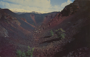 Postcard of a large crater in Craters of the Moon National Monument, Idaho.  | Craters of the Moon National Monument, Idaho. Big Craters - The largest of the accessible craters on the Loop Drive is about 100 feet deep and is 1/8 mile long.