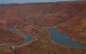 Postcard of the Oxbow Dam in Hell's Canyon on the Snake River between Oregon and Idaho.  | Oxbow Dam, finished in 1962 by Idaho Power Company as second unit in new Hell's Canyon development, harnesses the mighty Snake River in a bold construction feat. The name comes from the unusual sharp turns of the river in the shape of an ox bow.