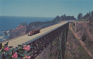 Postcard of a log truck crossing the Thomas Creek Bridge near Brookings, Oregon. | Thomas Creek Bridge. 10 miles north of Brookings, Oregon. On hiway 101. Lumber truck crossing highest span in Oregon appears dwarfed by the steel framework disappearing into the gorge.