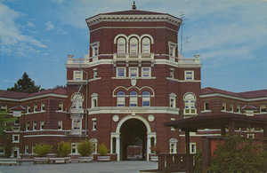 Postcard of a student dormitory on the Oregon State University campus in Corvallis, Oregon. | Weatherford Hall, Oregon State University, Corvallis. This 400 man residence hall bears the name of Mr. J.K. Weatherford, member of the Board of Regents from 1888 to 1929. The Memorial Union, center of student activities, lies just beyond the archway.