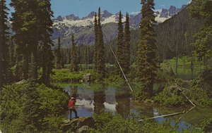 Postcard of a man fishing on Pete Lake in Washington state.  | Pete Lake. One of the hundreds of beautiful alpine lakes in the Salmon La Sac Recreational Area in Wenatchee National Forest in the Cascade mountains in Washington State. Easily accessible through the Salmon La Sac Mountain Resort.