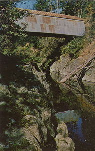 Postcard of a covered bridge over the Chehalis River in Washington State. |  Pe Ell, Lewis County, Washington, covered bridge across the Chehalis River. Bridge built 1934 is owned and used by the Pe Ell Water Department. (It also carries wooden water pipe, sole water supply for the town of Pe Ell).