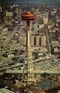Postcard of the Space Needle in Seattle, Washington. | The Space Needle, Seattle, Washington. It rises to the height of 600 feet and is topped by a restaurant which revolves 360? every hour. About 260 persons can be served. An observation deck and snack service is also atop the Needle for those who wish to feast mostly on the tremendous scenic panorama.